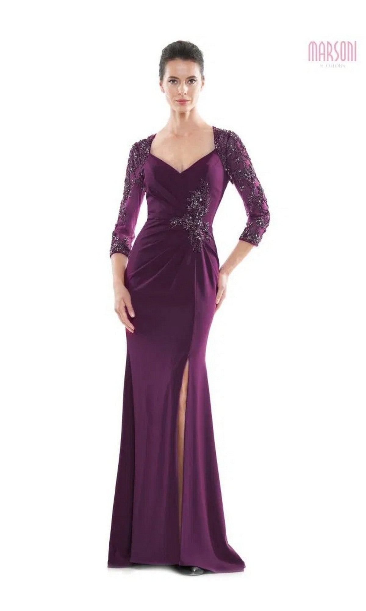 A woman in the Long Formal Dress: Marsoni MV1070, a floor-length eggplant gown with beaded appliques, three-quarter sleeves, and a front slit, stands against a white background.